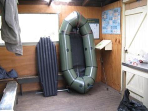 Packraft and Big Agnes mattress/floor inside Supper Cove Hut